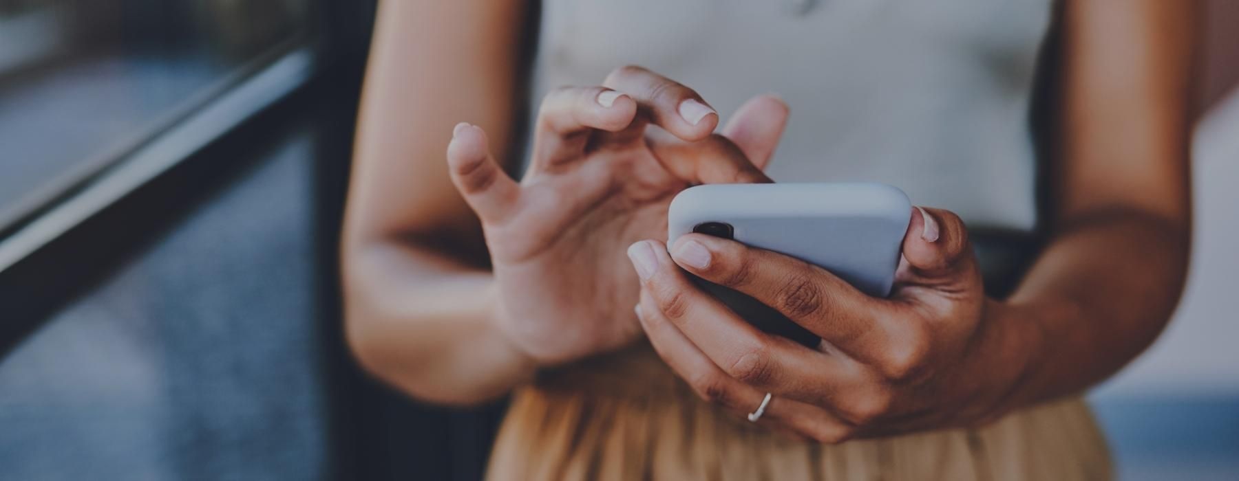 a person holding a white device