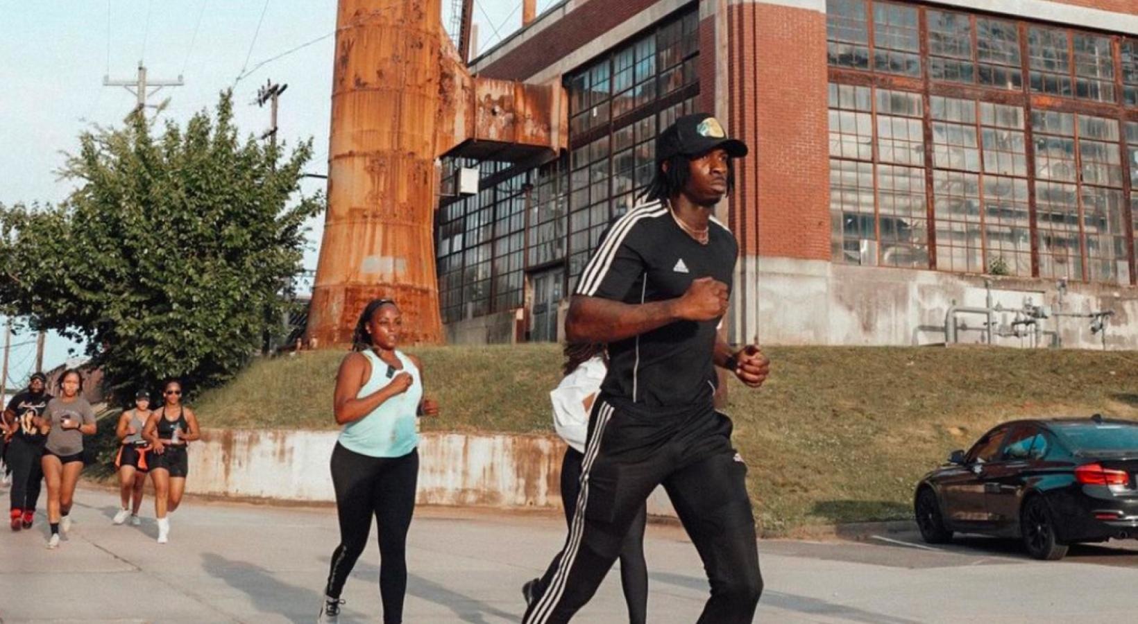 Close to the center of everything a person running on a street