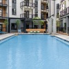 Resort-style swimming pool with lounge seating