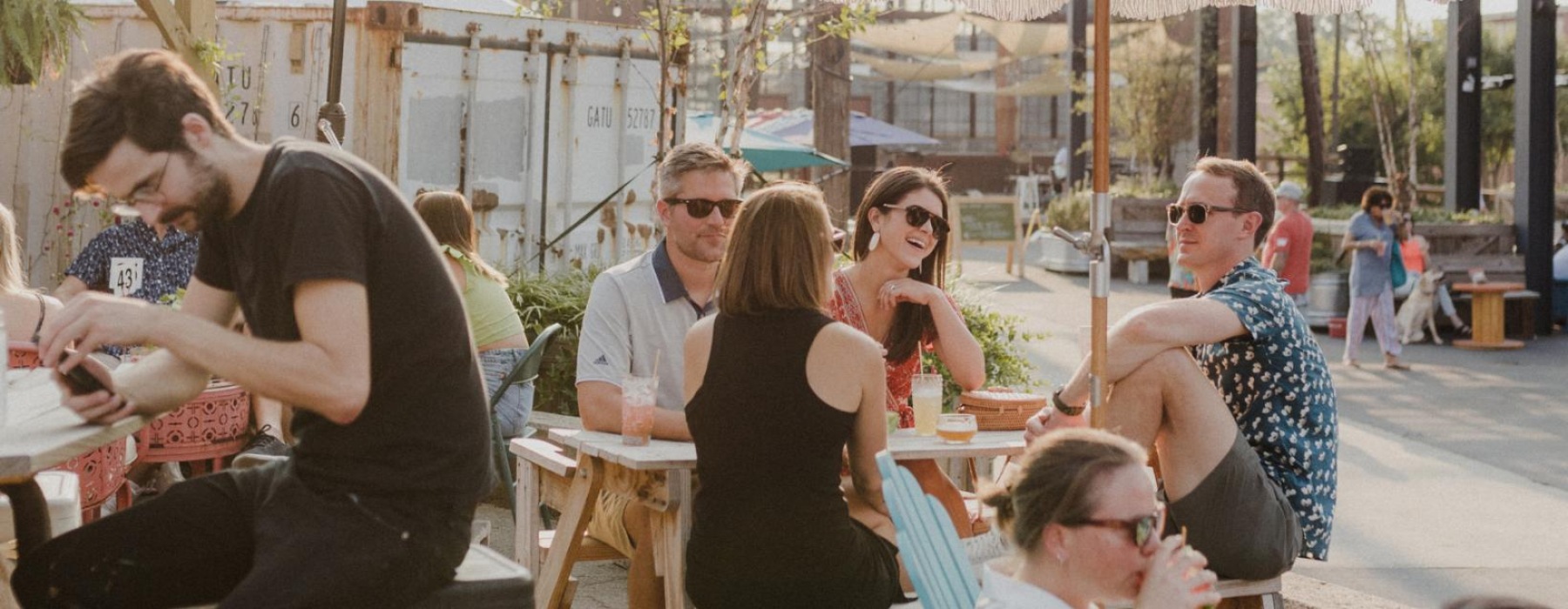 a group of people sitting at tables