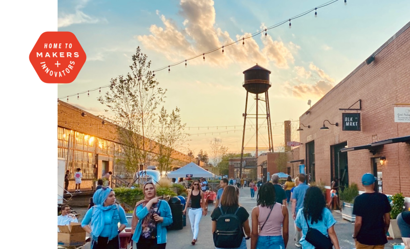 a water tower and a small gathering of people